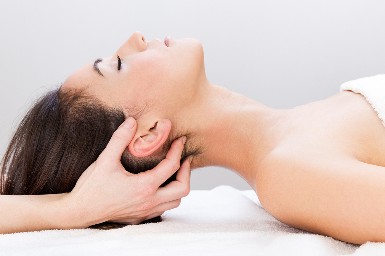 Woman enjoying massage at beauty spa